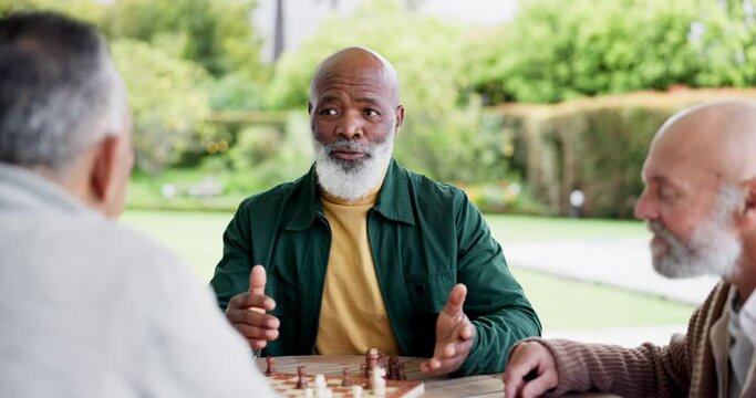 Man, chess and game with talk for strategy by planning to win in park, garden or outside. Elderly people, friends and together for fun, challenge or tournament for play in retirement with competition