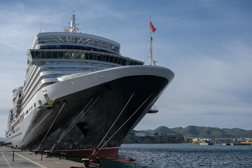 Classic British luxury ocean liner cruiseship cruise ship in Ibiza port with red, black and white...