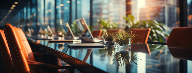 wide background image, view from side of office meeting table with exclusive chairs and shiny table top