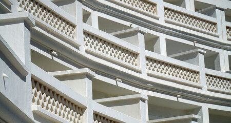 Architectural  detail of white washed apartments balconies 