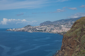 Fototapeta na wymiar Canico, Madeira, Portugal – September 24 2023: Looking out over the bay of Funchal from Miradouro do Cristo Rei, Ponta do Garajau, on an early autumn day.