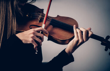 violin in female hands close-up