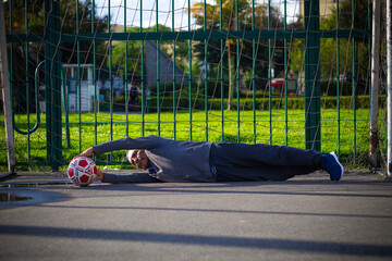 pensioner senior man with a soccer ball in a park