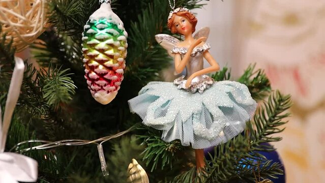 Christmas tree with decorations, figures of ballerinas.