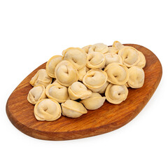 Homemade frozen dumplings on a wooden board on a white background, isolated