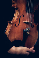 Fototapeta premium violin in female hands close-up
