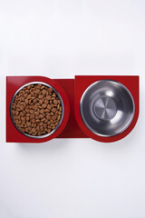 Obraz na płótnie Canvas Dry dog and cat food in metal bowl, top view and flat lay