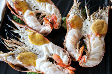 Grilled river prawns served on plate with vegetable