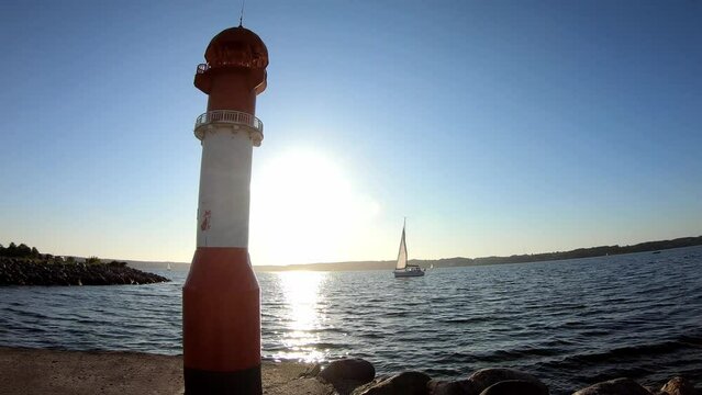 Timelapse shot of sailboat entering the harbour at the Baltic Sea