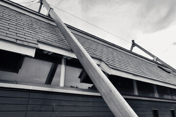 Abstract view of a modern coastal lifeboat house showing the metal girder structure and sloping...