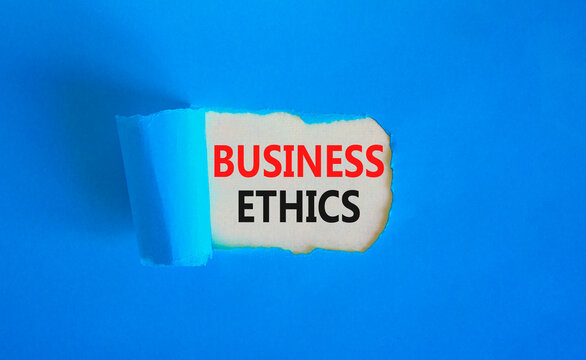 Business ethics symbol. Concept words Business ethics on beautiful white paper. Beautiful blue paper background. Business ethics concept. Copy space.