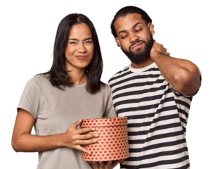 Latina couple with Valentine's heart box touching back of head, thinking and making a choice.