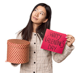 Young Chinese woman holding heart for Valentine's Day