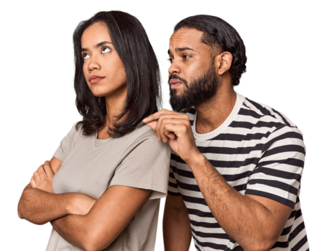 Young Latin man apologizing, couple back-to-back, studio