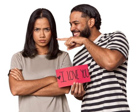 Young Latin couple holding 'I love you' sign, Valentine's