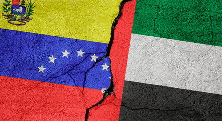 Venezuela and United Arab Emirates flags on a stone wall with a crack, illustration of the concept of a global crisis in political and economic relations