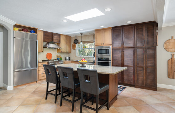 Florida vacation rental kitchen with breakfast island and stainless appliances