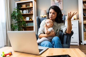 Business woman on maternity leave. Mother with newborn baby working from home using laptop. Female...