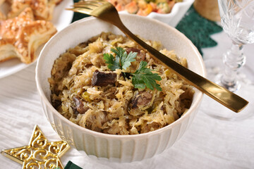 A bowl of sauerkraut with mushrooms and prunes for Christmas Eve supper