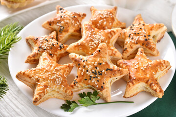 Star shaped puff pastry pies filled with mushrooms for Christmas Eve supper