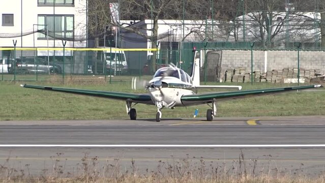 Private Small Airplane Aircraft Lining up on the runway at Local Regional Airport | small plane lining up rolling on the runway of a small regional airport