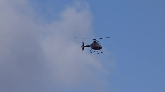 Helicopter flying towards the camera at regional airfield airport