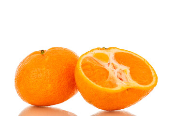 One half and one whole juicy fresh tangerines, macro, isolated on white background.
