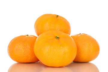Several juicy fresh tangerines, macro, isolated on white background.