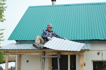 The man on the roof, engaged in the act of repair, symbolizes the continuous effort required to keep a home in good condition against weathering challenges.