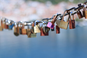 Makarska Croatia. Line of Love padlocks hanging on a chain by the sea. Love locks. Wedding locks....
