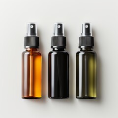 Various bottles / spray bottles made of glass and metal for cosmetics, natural medicine , essential oils or other liquids isolated over a black background, top view