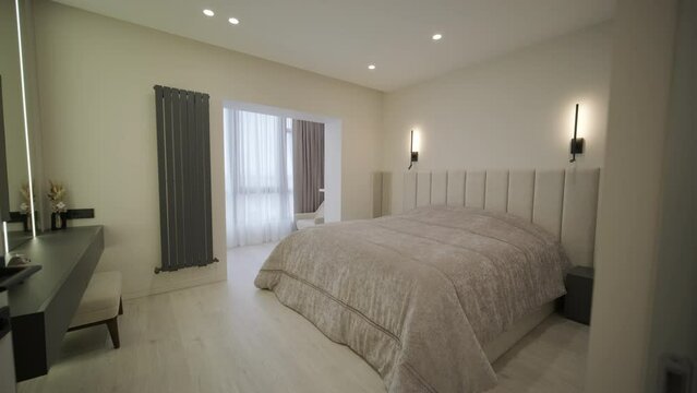 Interior of cozy bedroom in modern design with craft floor lamp