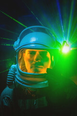 Spaceman or star trooper in the helmet in dark teleporting through the portal concept. Science...