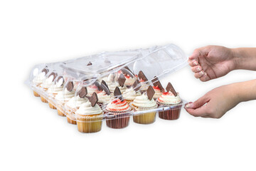 female hands opening full cupcake tray