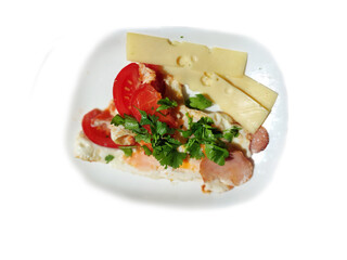 Scrambled eggs with bacon, herbs, tomatoes and cheese on a white background