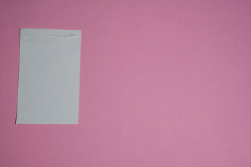 pink note paper on wall