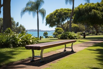 A serene park bench overlooks a calm waterscape, inviting reflection