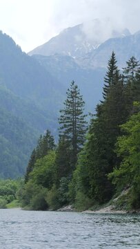 Lake Lago del Predil in Italy and Misty Mountains in the Background in Summer