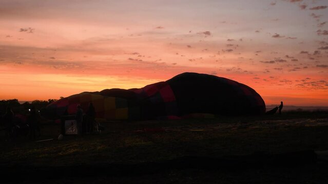 Silhouette Hot air balloons being inflated for flight during a beautiful sunrise in the Serra da Canastra mountains in Minas Gerais, southeastern state of Brazil