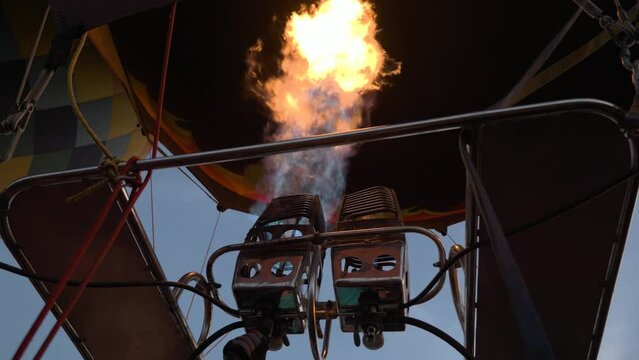 Close up of the fire mechanisms that make hot air balloons fly during a beautiful sunrise in the mountains of Serra da Canastra in Minas Gerais, southeastern state of Brazil