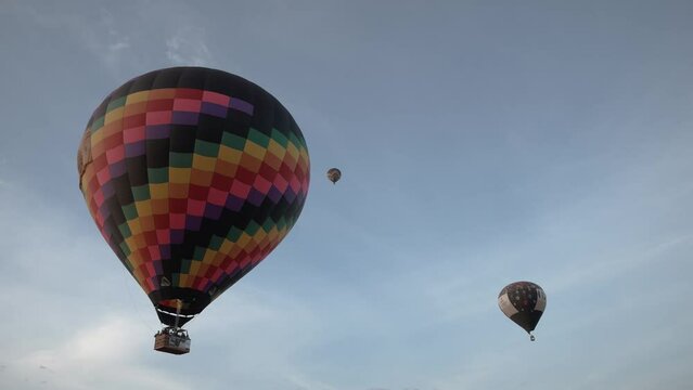 Hot air balloons flying during a beautiful sunrise in the Serra da Canastra mountains in Minas Gerais, southeastern state of Brazil