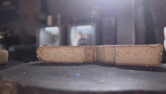 A piece Serra da Canastra Cheese that was cured in a cellar of a Brazilian Farm