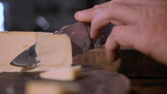 A piece Serra da Canastra Cheese that was cured in a cellar of a Brazilian Farm