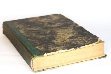 Vintage book in hard cover, white background, selective focus