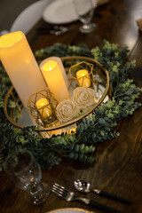 Yellow candles on table dressed for wedding or event
