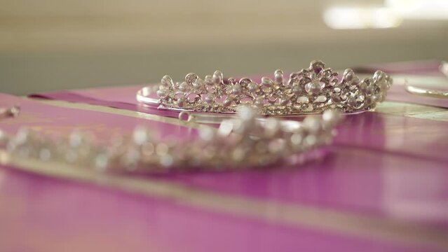 Crowns for winners of beauty contest lie on table