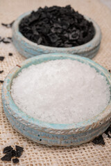 Black and white sea salt close up, Cyprus Black Salt shiny black pyramid-shaped crystals