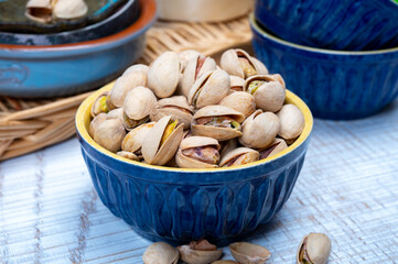 Roasted salty pistachio nuts, tasty healthy vegetarian snack food