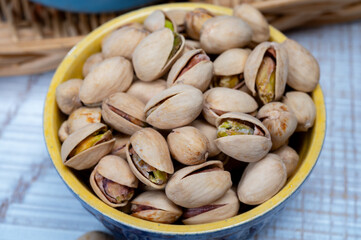 Roasted salty pistachio nuts, tasty healthy vegetarian snack food