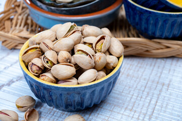 Roasted salty pistachio nuts, tasty healthy vegetarian snack food